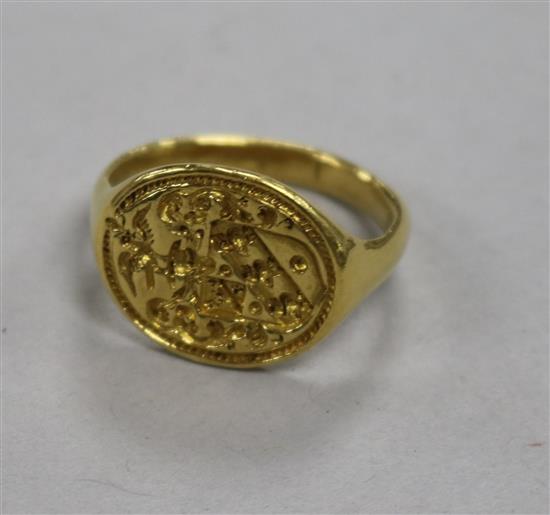 A yellow metal signet ring with shield-carved matrix 9.6g